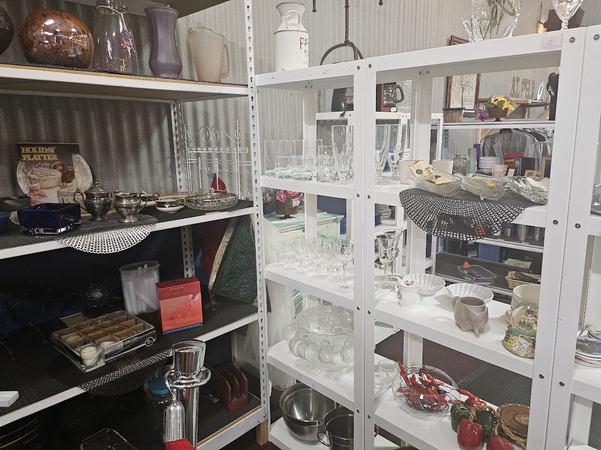 Glassware and housewares on white shelves